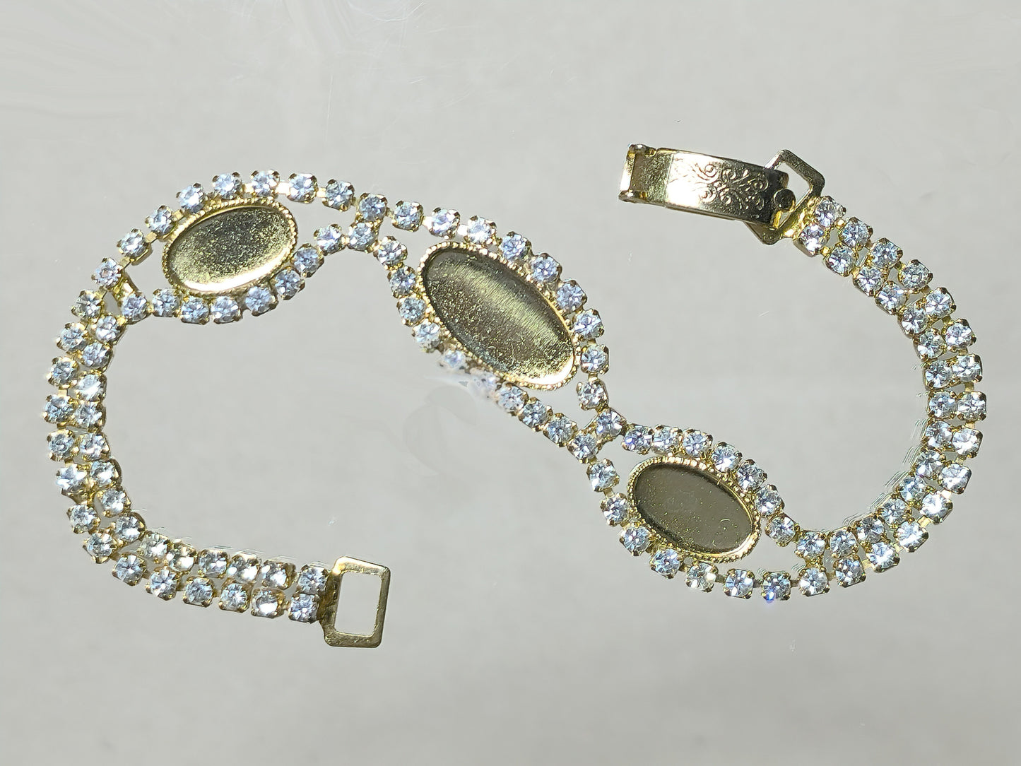 54231.0 - Gold Plated bracelet with Swarovski Rhinestones and 14x7 mm and 10x6 mm cupsup for cabochon stone