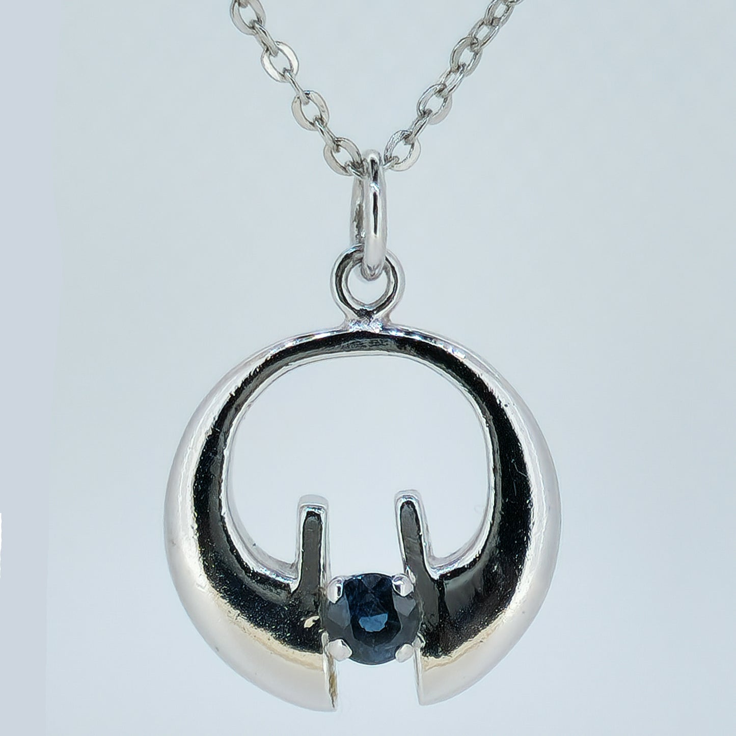 07745.0 - Sterling Silver Pendant set with either a blue or a teal coloured 4.25 mm about 0.50 carat natural Australian Sapphire 22 mm high