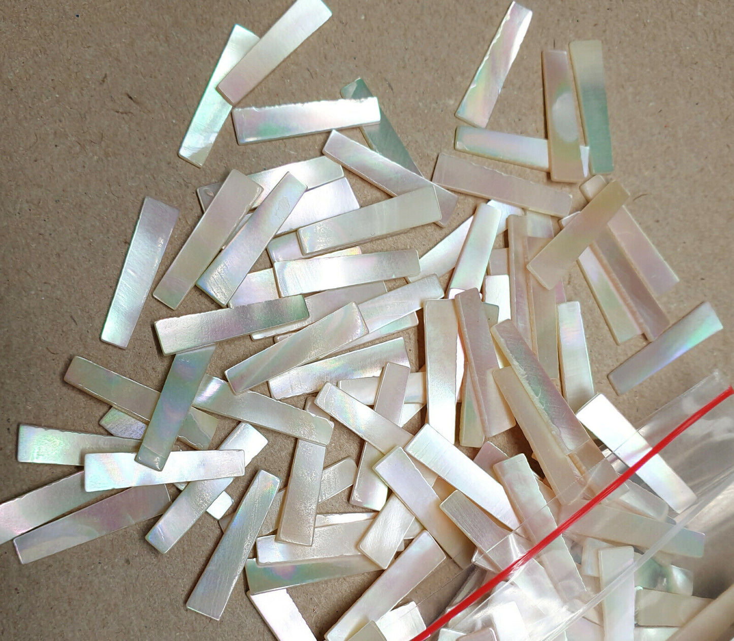11843.1 - 240 Mother of Pearl 19 x 5.5-4.5 mm Tapered Rectangles