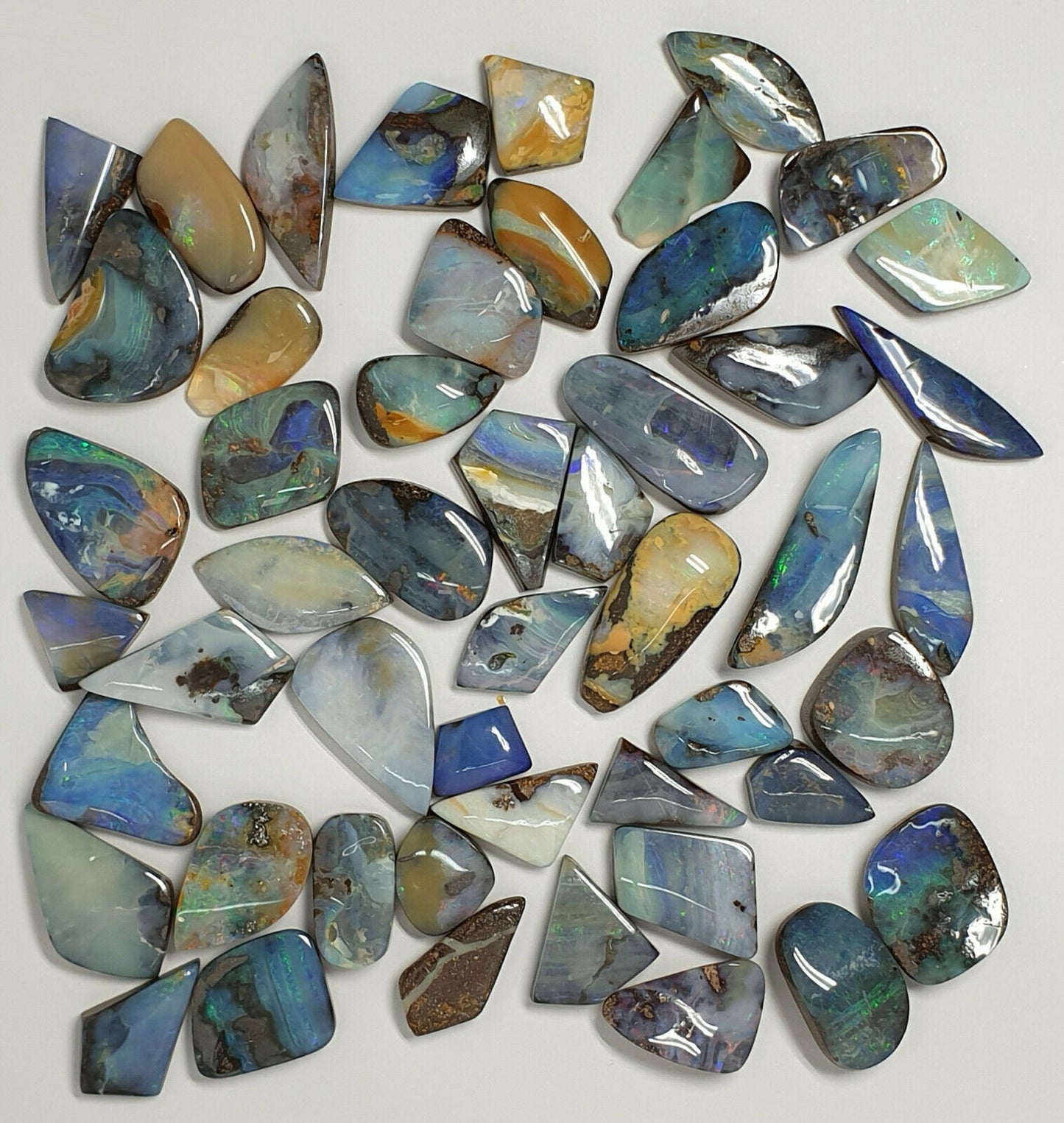 53538.0 - 50 Boulder Opal Free Cut Polished Faces 285.43 carats Smallish Sized