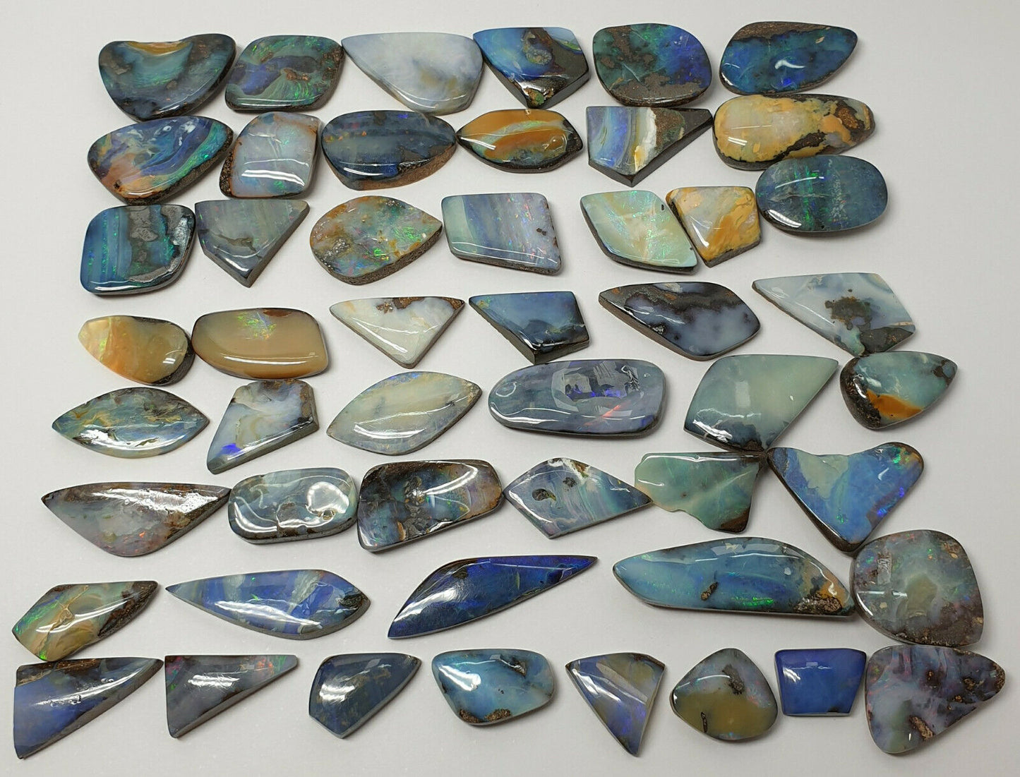 53538.0 - 50 Boulder Opal Free Cut Polished Faces 285.43 carats Smallish Sized
