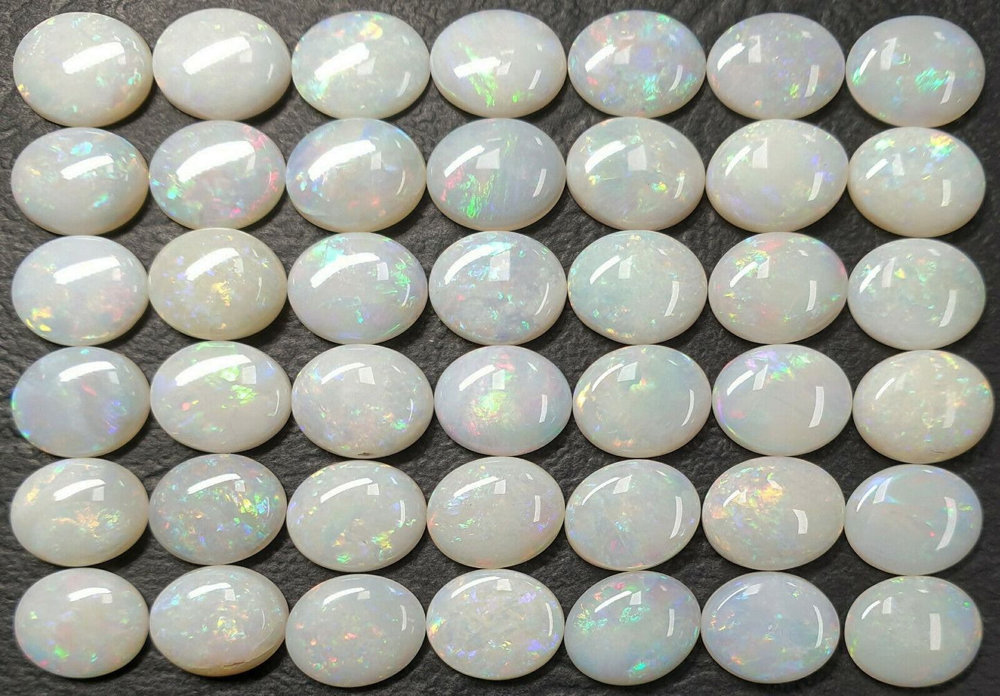 53512 - 42 Pieces Australian 10 x 8 mm Oval Cut Milky White Opal For Sale
