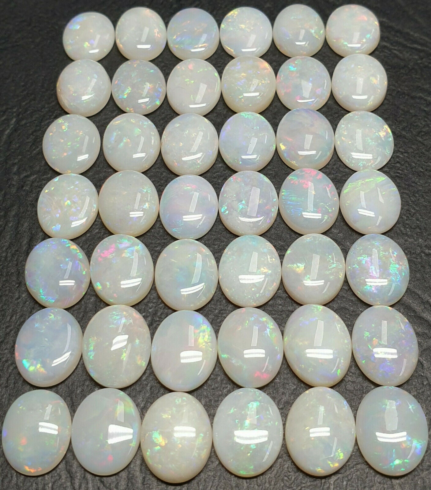 53512 - 42 Pieces Australian 10 x 8 mm Oval Cut Milky White Opal For Sale
