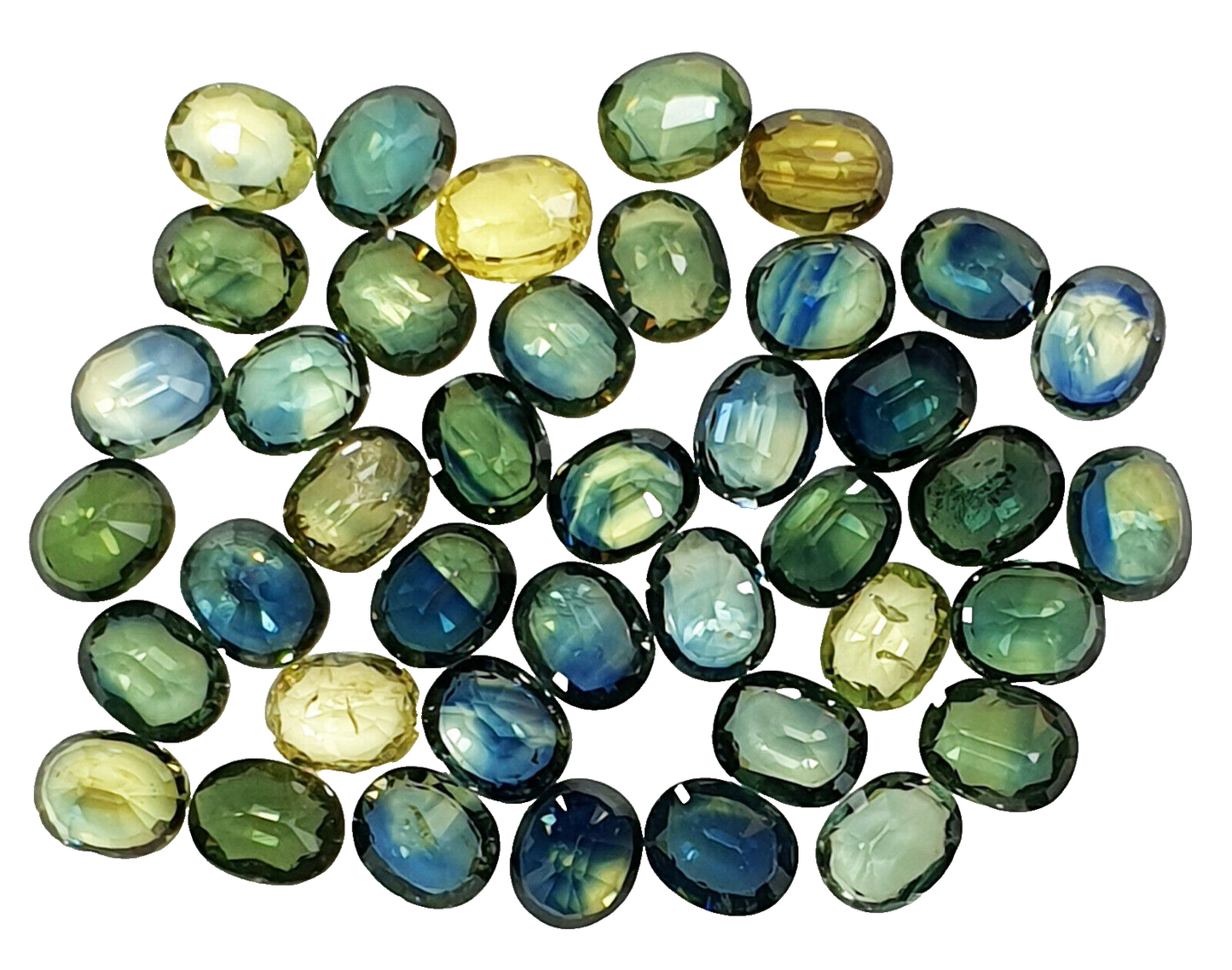 52219 - 40 Oval Cut Aussie Teal, Green, Yellow, Parti Color Sapphires 19.47 cts