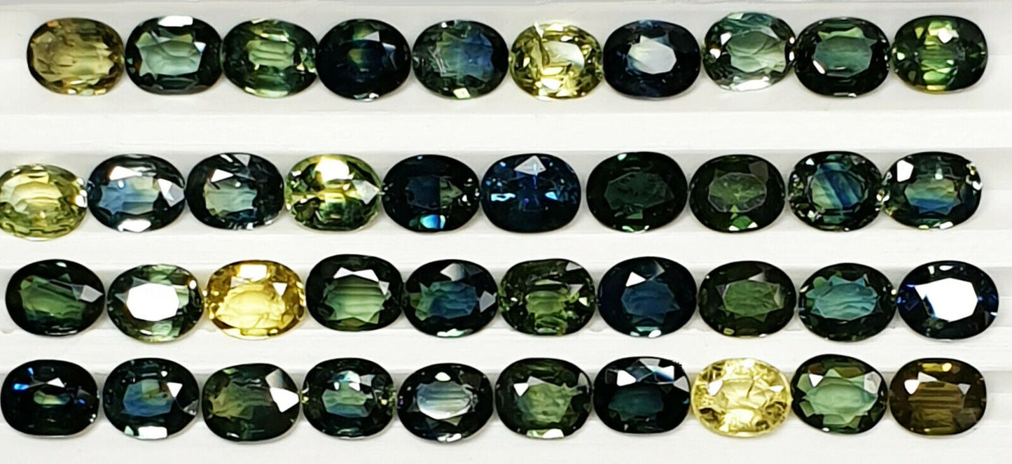 52219 - 40 Oval Cut Aussie Teal, Green, Yellow, Parti Color Sapphires 19.47 cts