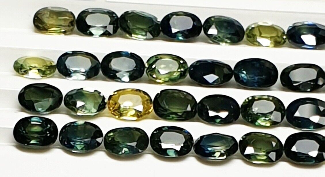 52219 - 40 Oval Cut Aussie Teal, Green, Yellow, Parti Color Sapphires 19.47 cts