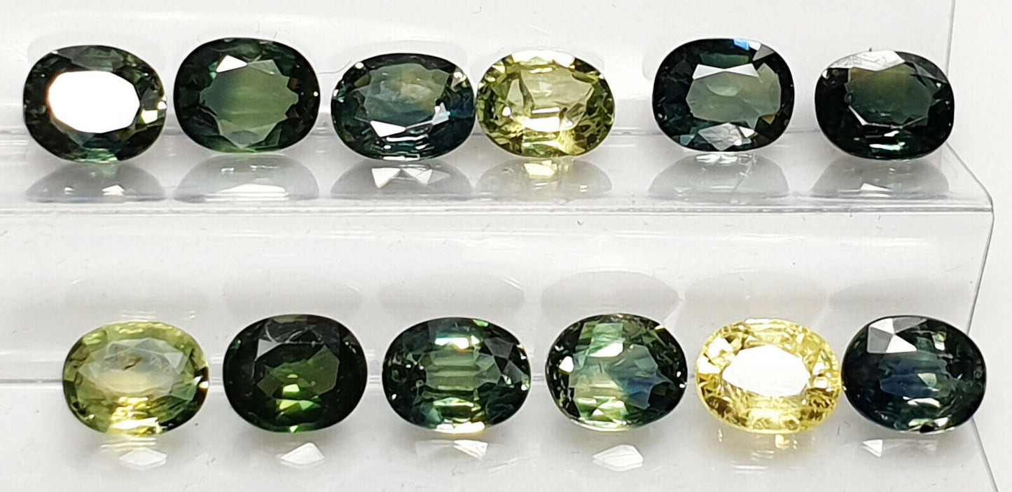 52219 - 40 Oval Cut Aussie Teal, Green, Yellow, Parti Color Sapphires 19.47 cts