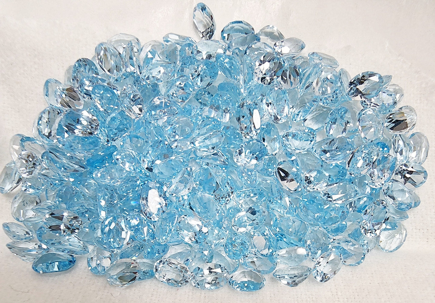 15297.0 - 6 x 4 mm Oval Cut Light Blue Topaz in Various Wholesale Lots for sale Old stock at very old price Other sizes and shapes available