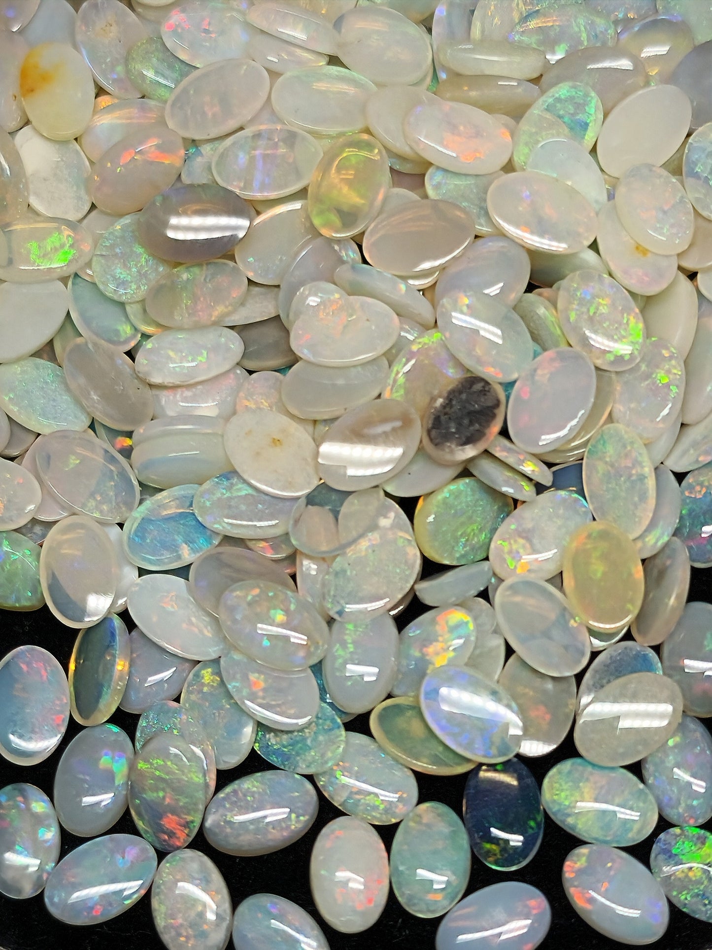 54068.0 - 6x4 mm Natural Sold White Australian Opal Oval Cabochon Cut in a Mixed Quality