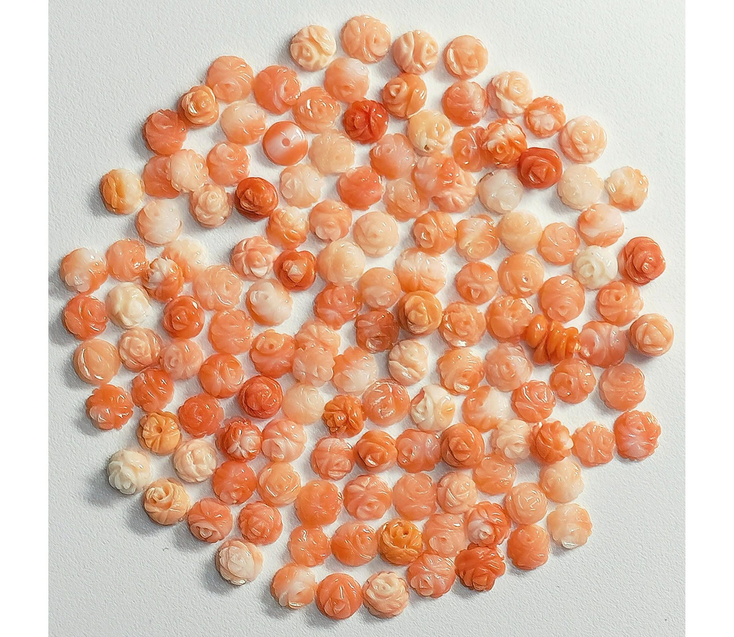 54051.0 - 4.5 to 5.0 mm flat back carved coral Small pin hole on the back Mixed colours of genuine Taiwan coral harvested 1970's