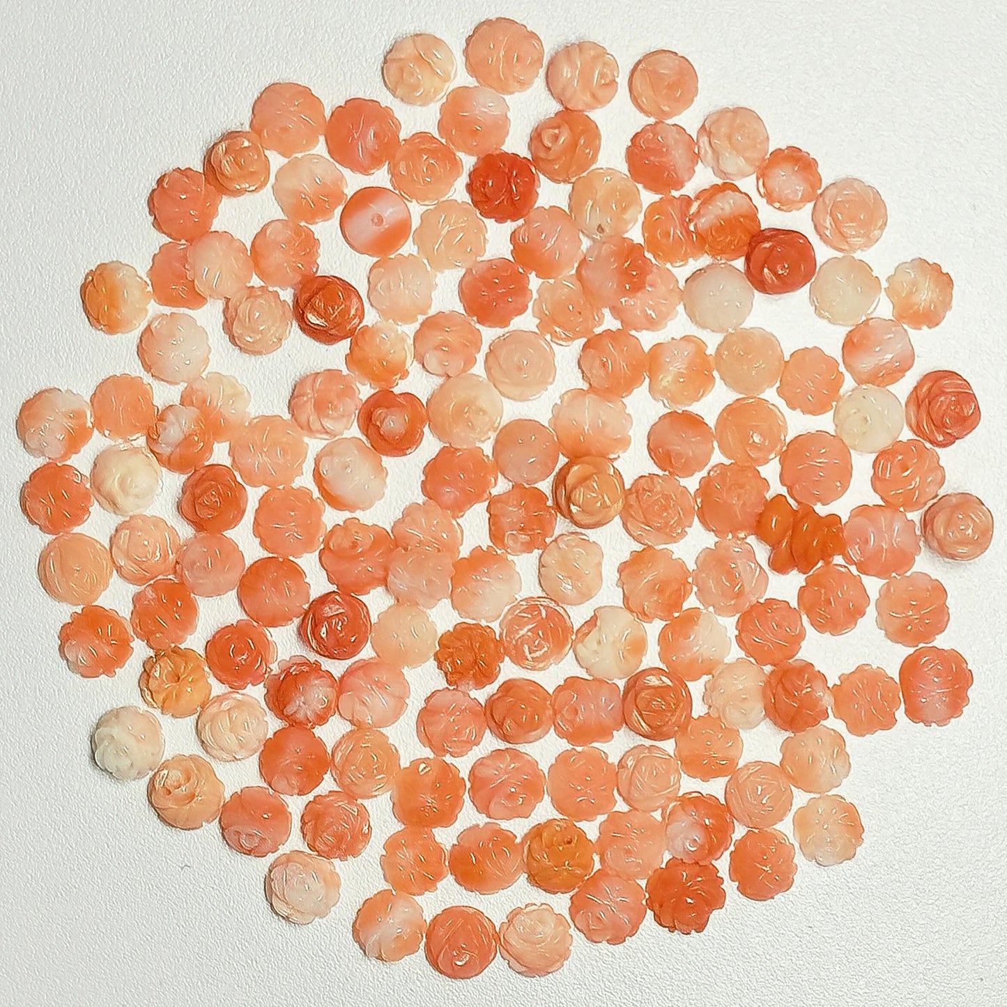 54051.0 - 4.5 to 5.0 mm flat back carved coral Small pin hole on the back Mixed colours of genuine Taiwan coral harvested 1970's