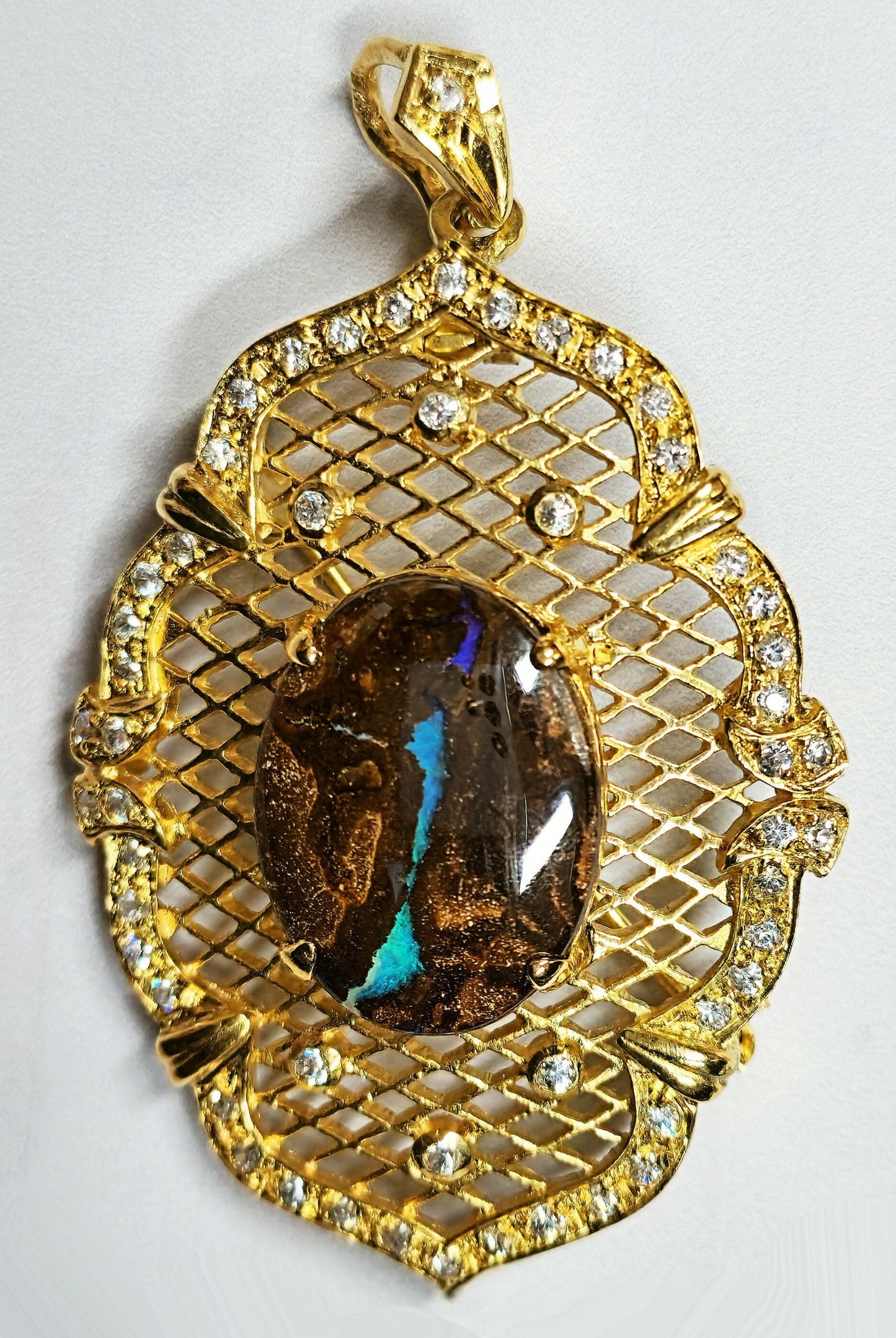 10052.30 - Utvalg av Sterling Sølv Gullbelagt kombinasjonsanheng/brosjesett med Aussie Boulder Opal og CZs valg av Opal kvalitet
