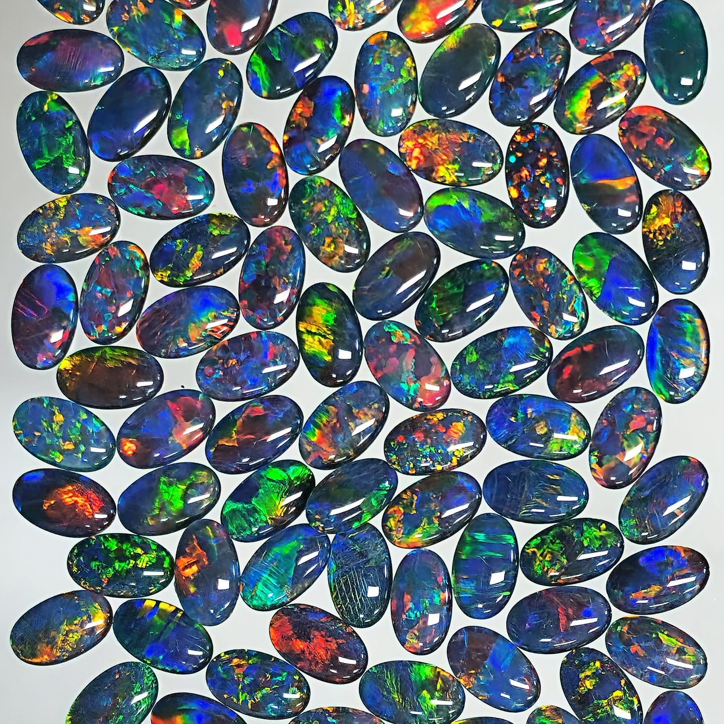 54125.0 - 10 X 6 mm Oval cut Australian Opal Triplets made with Aussie rough Opal Top grade brilliant stones Wholesale quantities and prices