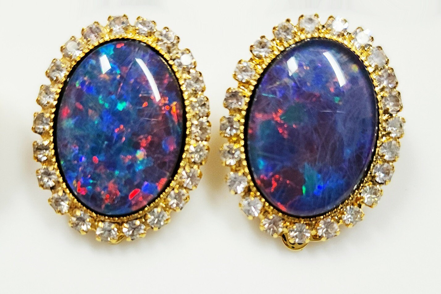 04110.0 - Gold Plated ClipOn Earrings for sale Set with large 18x13 mm Oval Cut Quality Australian Opal Triplets surrounded by Rhinestones