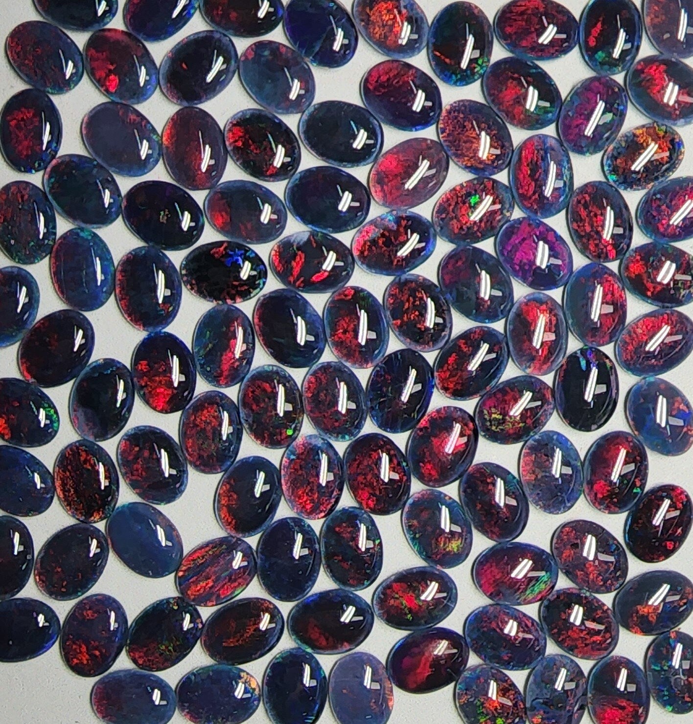 53946.0 - 8x6 mm Oval Cut Australian Opal Triplets For Sale in either Blue or Green or Red Colour or in a Combination of All Three Colours