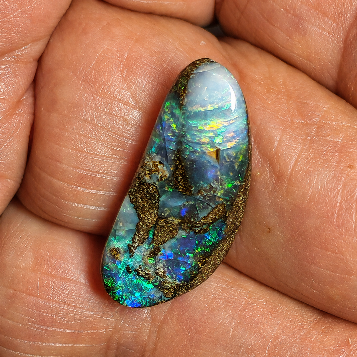 54529. Boulder Opal with Undulating Face: 15 Carats