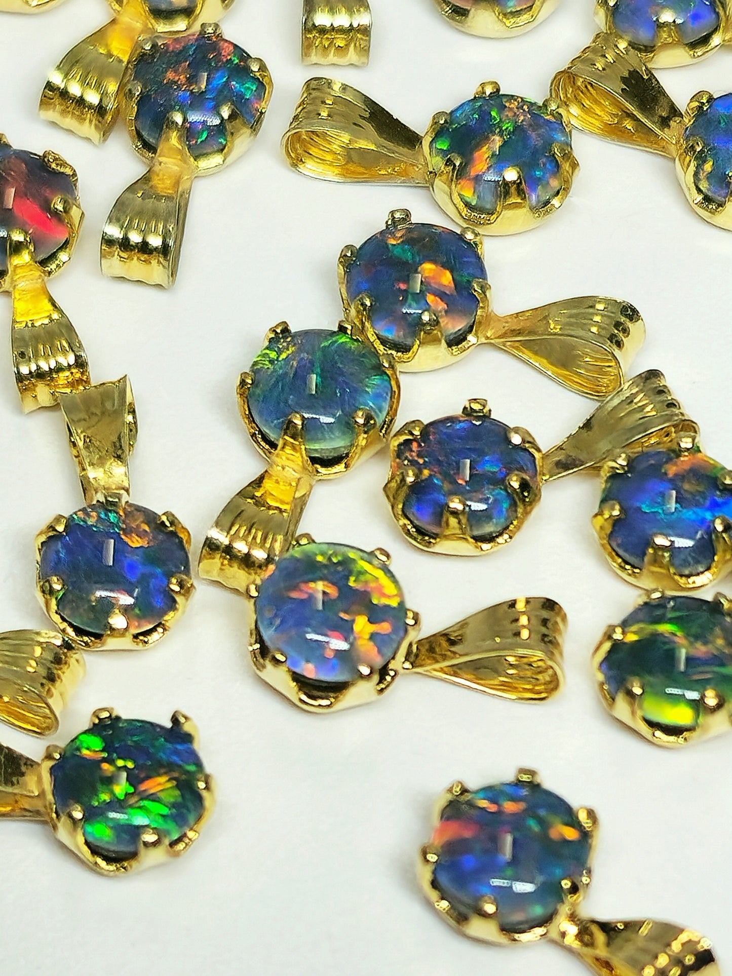 04392. Sterling Silver Gold Plated Opal Triplet Pendants