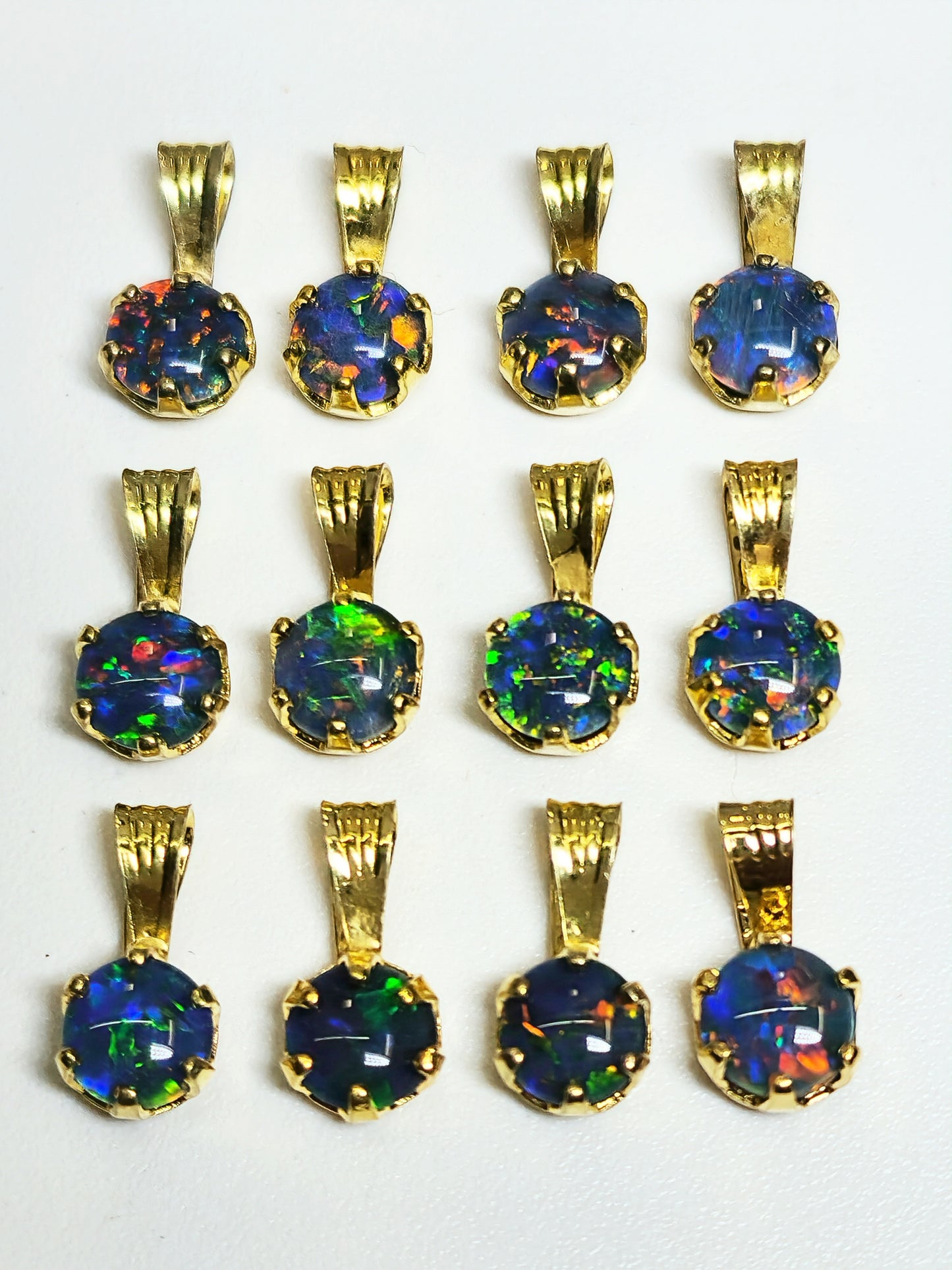 04392. Sterling Silver Gold Plated Opal Triplet Pendants