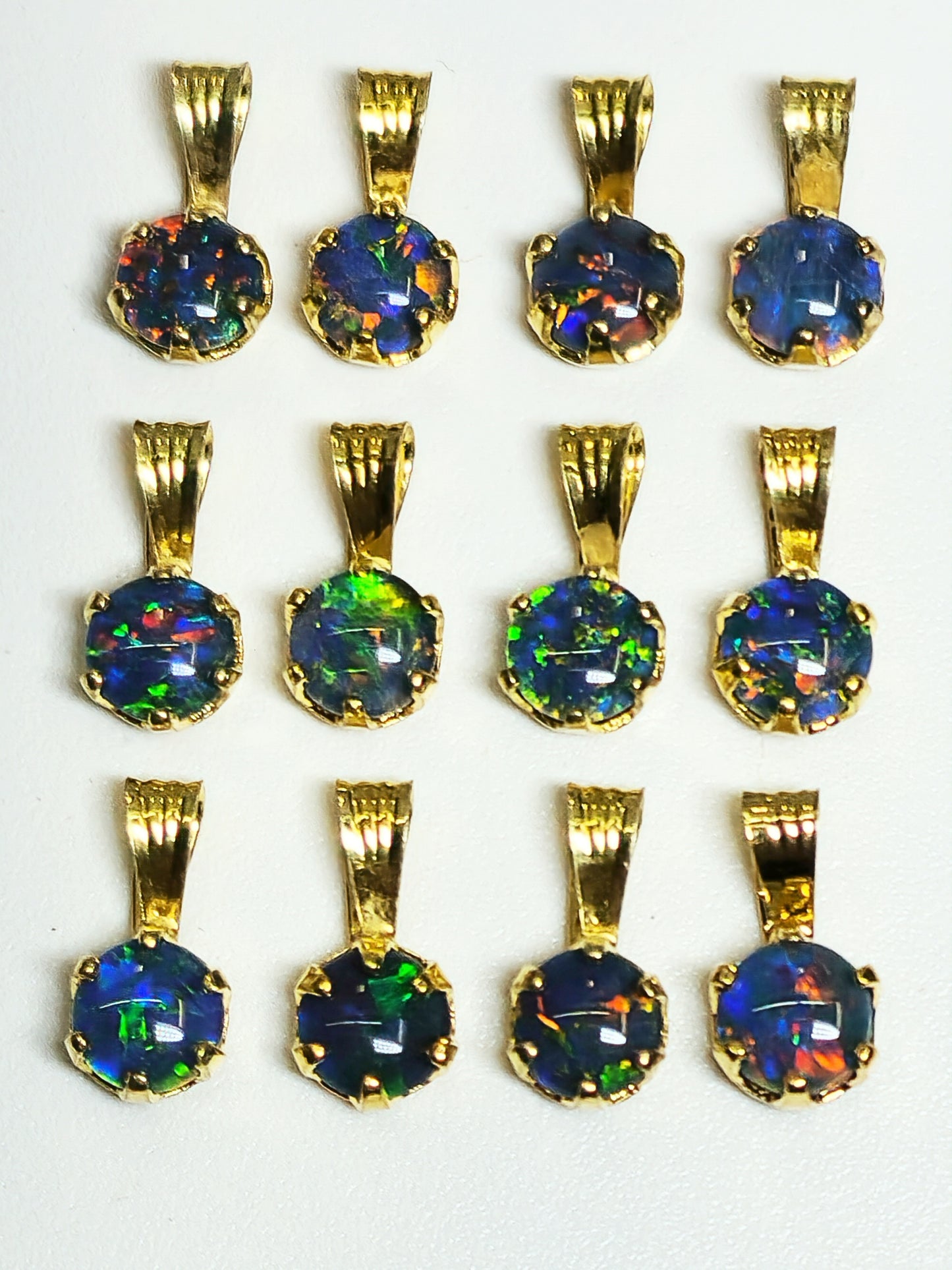 04392. Sterling Silver Gold Plated Opal Triplet Pendants