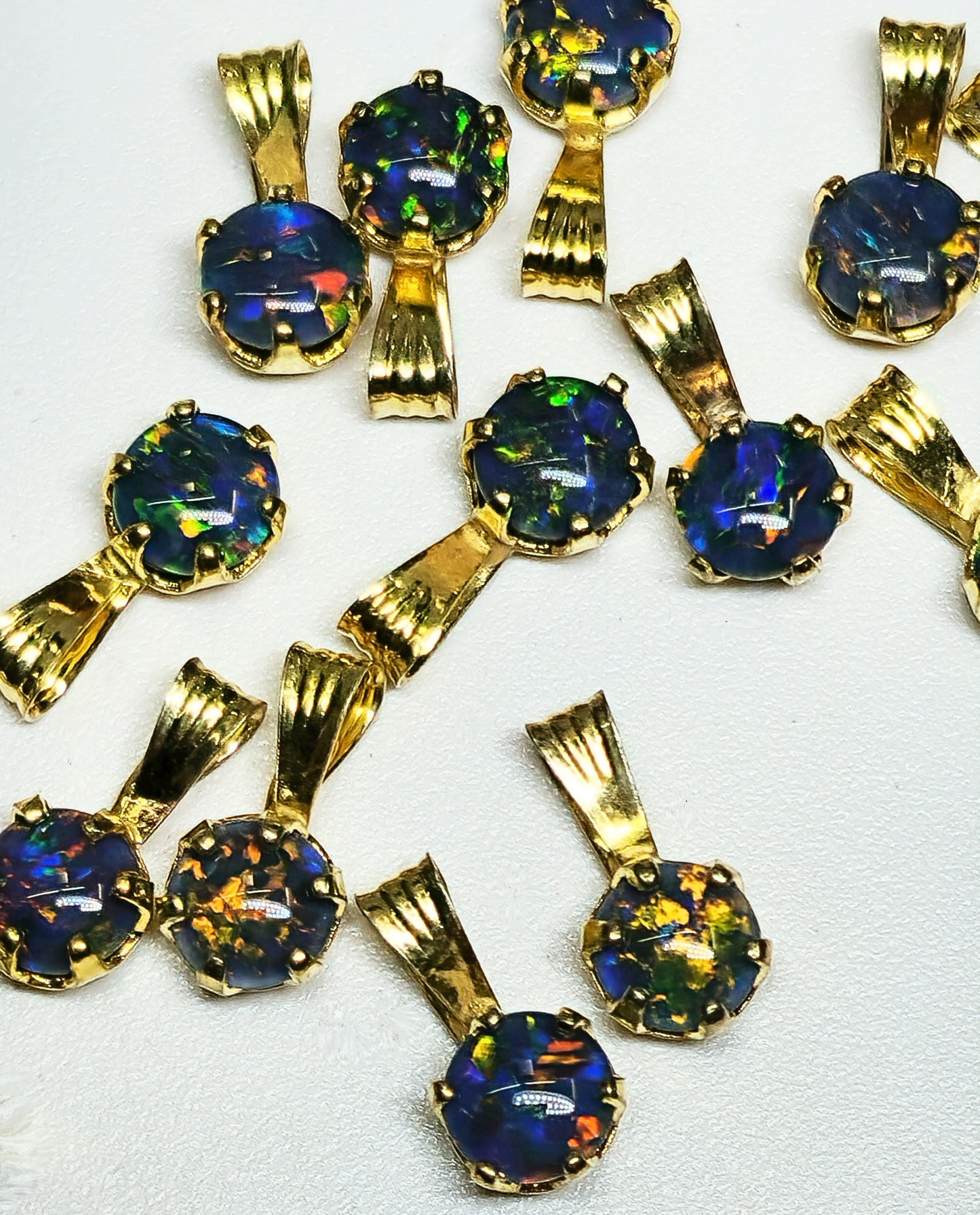 04392. Sterling Silver Gold Plated Opal Triplet Pendants