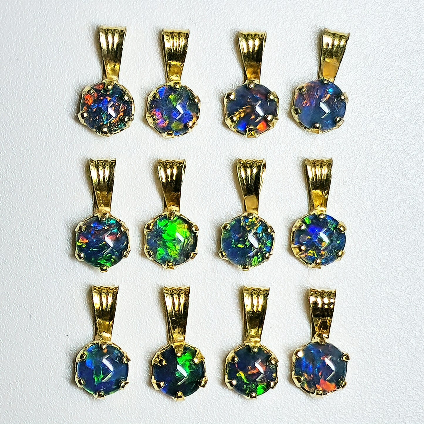 04392. Sterling Silver Gold Plated Opal Triplet Pendants