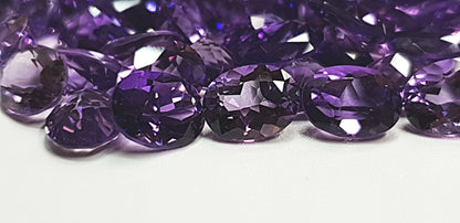 15367 - One Wholesale Lot of 55 pieces 9x7 mm Oval Cut Purple Amethyst for sale