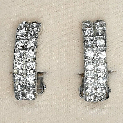 08786 - 24 Pairs of Silver Coloured Clip On Earrings + Clear Rhinestone Crystals
