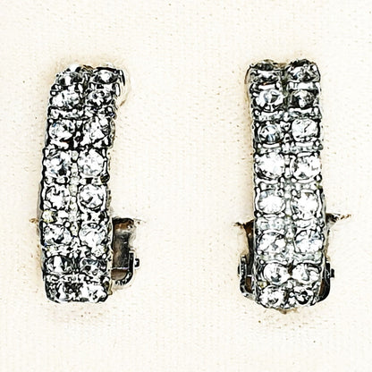 08786 - 24 Pairs of Silver Coloured Clip On Earrings + Clear Rhinestone Crystals