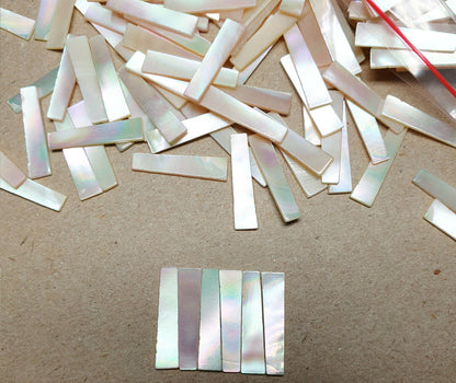 11843.1 - 240 Mother of Pearl 19 x 5.5-4.5 mm Tapered Rectangles