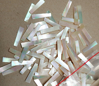 11843.1 - 240 Mother of Pearl 19 x 5.5-4.5 mm Tapered Rectangles