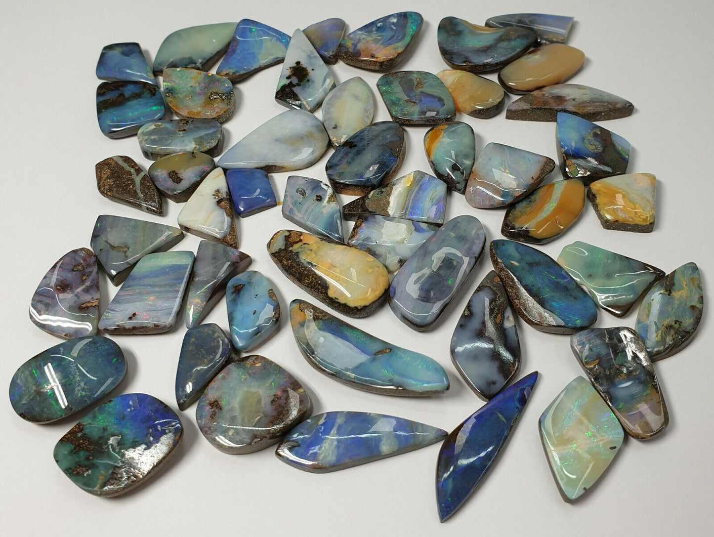 53538.0 -  50 Boulder Opal Free Cut Polished Faces 285.43 carats Smallish Sized
