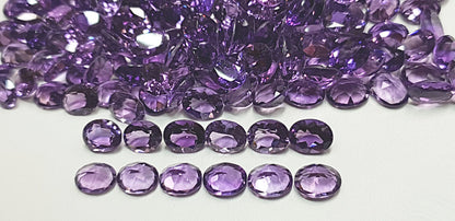 15367.0 - 55 piece lot 9 x 7 mm Oval cut Amethyst Medium to deep color Eye clean