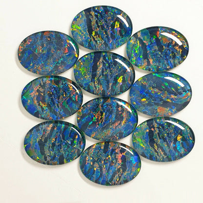 52022 - A Unique Set of 10 Matching 30x22 mm Oval Australian Opal Triplets