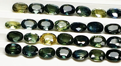 52219 -  40 Oval Cut Aussie Teal, Green, Yellow, Parti Color Sapphires 19.47 cts