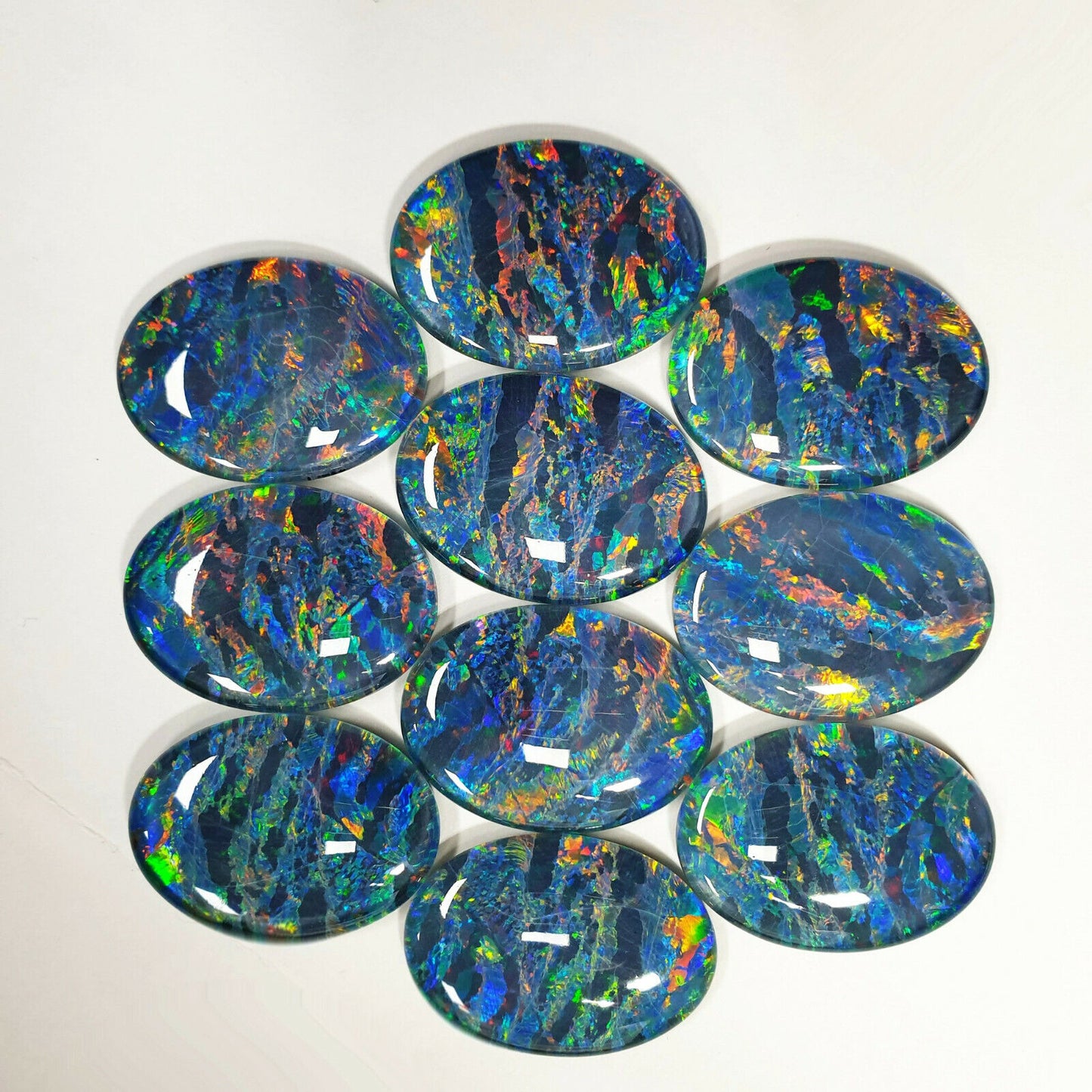 52022 - A Unique Set of 10 Matching 30x22 mm Oval Australian Opal Triplets