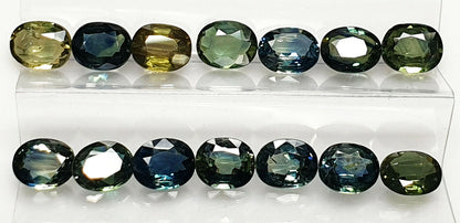 52219 -  40 Oval Cut Aussie Teal, Green, Yellow, Parti Color Sapphires 19.47 cts