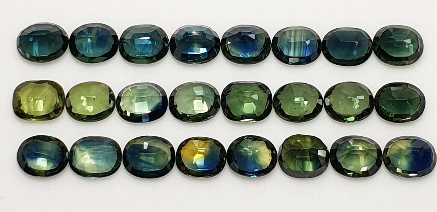 52213 - 24 Oval Cut Australian Teal, GreenS, Parti Coloured Sapphires 21.06 cts