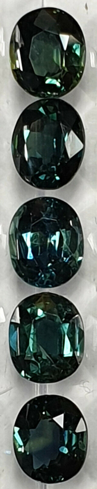52213 - 24 Oval Cut Australian Teal, GreenS, Parti Coloured Sapphires 21.06 cts