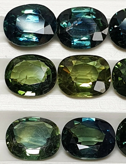52213 - 24 Oval Cut Australian Teal, GreenS, Parti Coloured Sapphires 21.06 cts