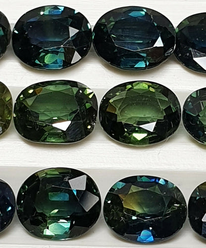 52213 - 24 Oval Cut Australian Teal, GreenS, Parti Coloured Sapphires 21.06 cts