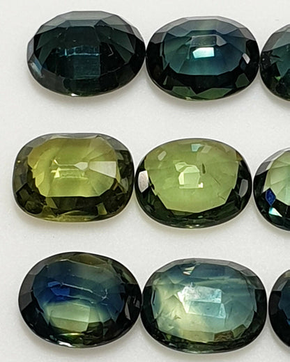 52213 - 24 Oval Cut Australian Teal, GreenS, Parti Coloured Sapphires 21.06 cts