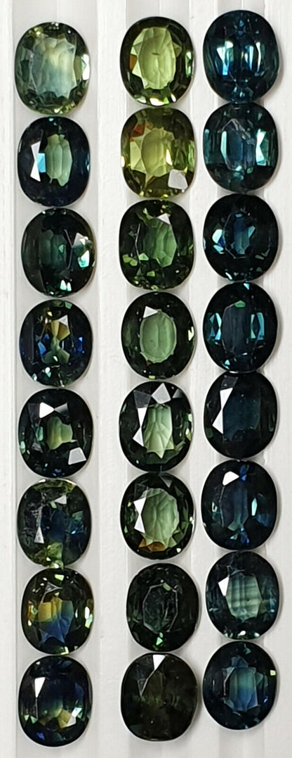 52213 - 24 Oval Cut Australian Teal, GreenS, Parti Coloured Sapphires 21.06 cts