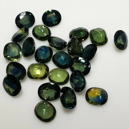 52213 - 24 Oval Cut Australian Teal, GreenS, Parti Coloured Sapphires 21.06 cts