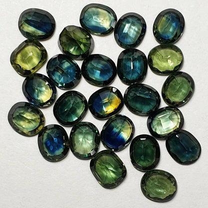 52213 - 24 Oval Cut Australian Teal, GreenS, Parti Coloured Sapphires 21.06 cts