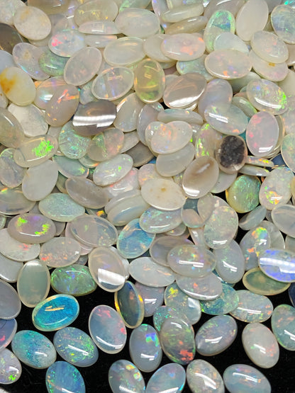 54068.0 - 6x4 mm Natural Sold White Australian Opal Oval Cabochon Cut in a Mixed Quality