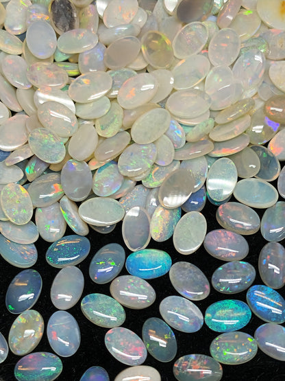 54068.0 - 6x4 mm Natural Sold White Australian Opal Oval Cabochon Cut in a Mixed Quality