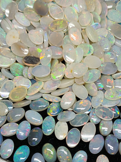 54068.0 - 6x4 mm Natural Sold White Australian Opal Oval Cabochon Cut in a Mixed Quality
