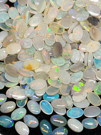 54068.0 - 6x4 mm Natural Sold White Australian Opal Oval Cabochon Cut in a Mixed Quality