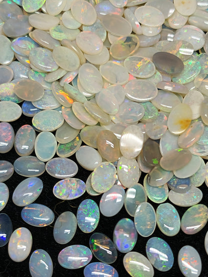 54068.0 - 6x4 mm Natural Sold White Australian Opal Oval Cabochon Cut in a Mixed Quality