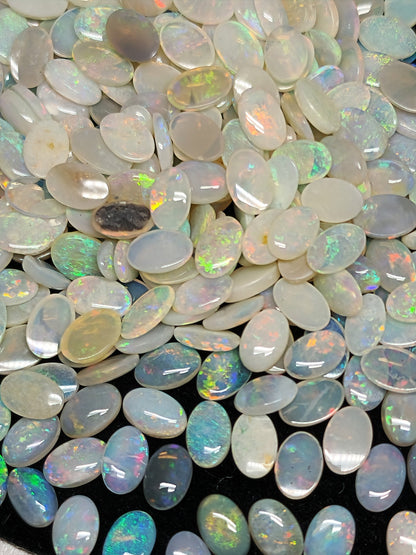 54068.0 - 6x4 mm Natural Sold White Australian Opal Oval Cabochon Cut in a Mixed Quality